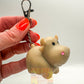 Pooping cow keyring