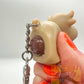 Pooping cow keyring