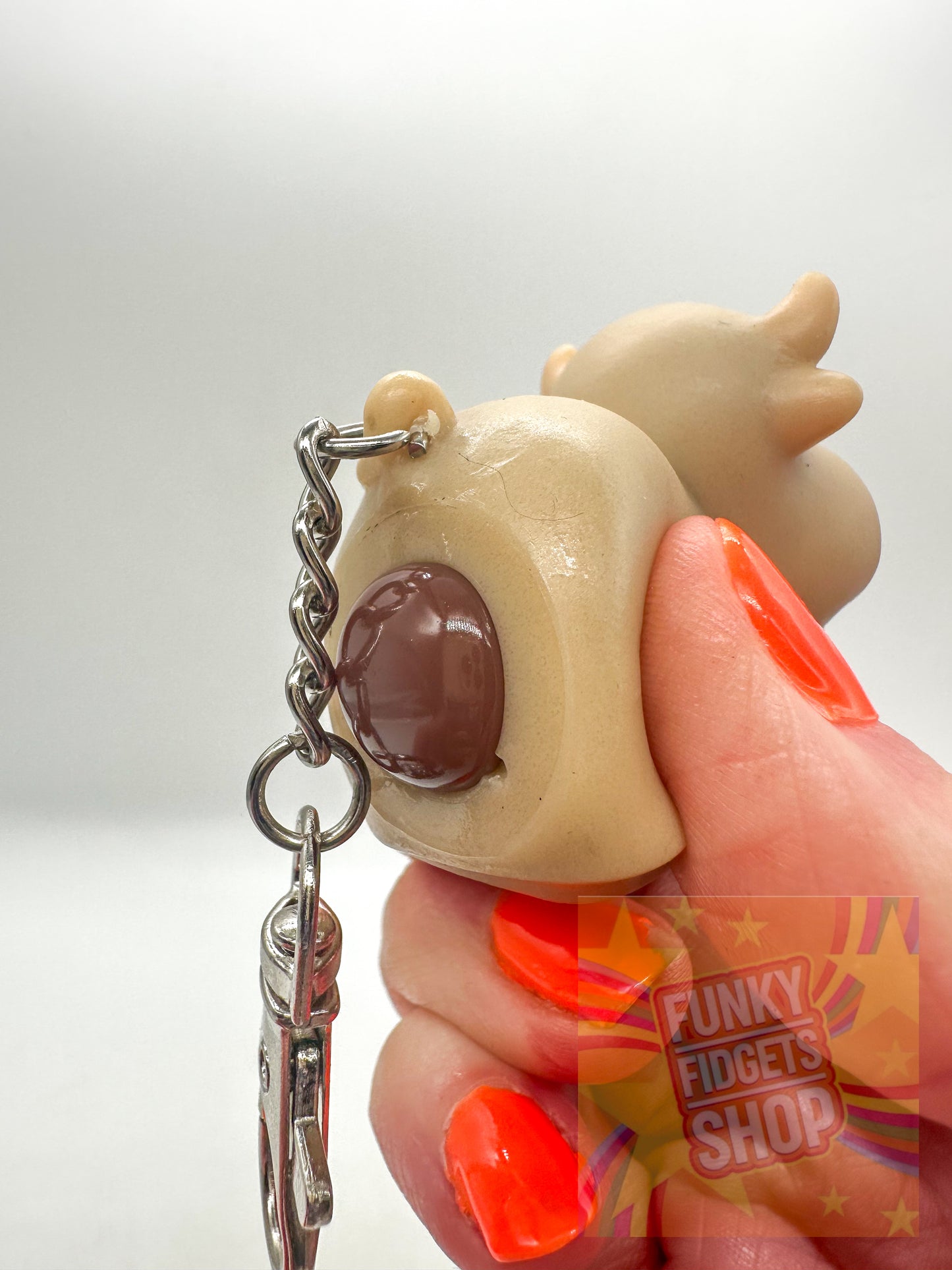 Pooping cow keyring