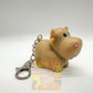 Pooping cow keyring